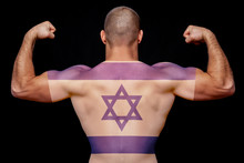 The Back Of A Young Athletic Man Wearing A T-shirt With The National Flag Of Israel On A Black Isolated Background. The Concept Of National Pride And Patriotism