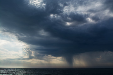 Wall Mural - storm clouds over the sea rain and thunder