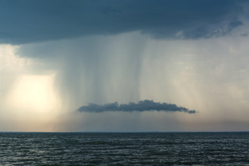 Wall Mural - storm clouds over the sea rain and thunder