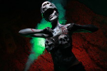 Zombie Death Girl With Scary Body Art Posing In The Night In Thesmoke Alone