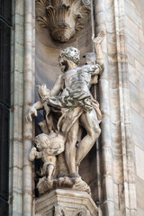 Statue of Saint on the facade of the Milan Cathedral, Duomo di Santa Maria Nascente, Milan, Lombardy, Italy