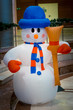 Snowman in a blue bowler hat and a scarf