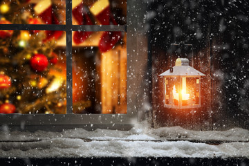 Christmas window sill of snow and ice and home interior 