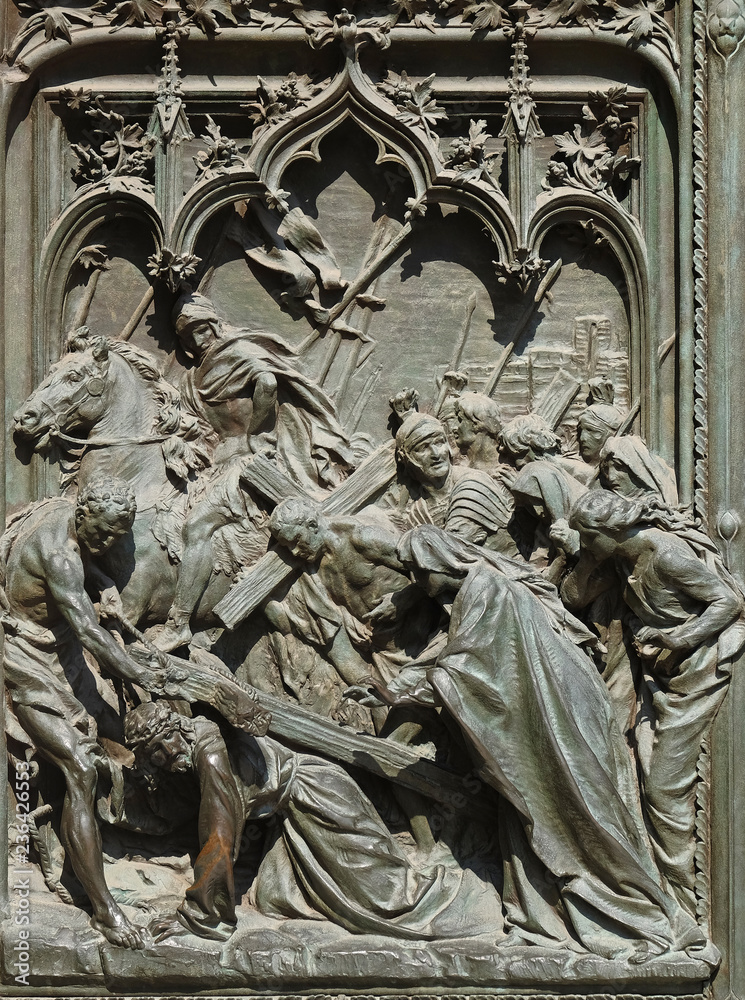 The death sentence and the way to the Calvary of Jesus Christ, detail of the main bronze door of the Milan Cathedral, Duomo di Santa Maria Nascente, Milan, Lombardy, Italy - obrazy, fototapety, plakaty 