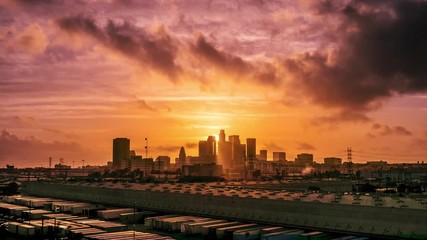 Aufkleber - Sunset sun setting behind city of Los Angeles downtown skyline at sunset, changing to night. 4K UHD Timelapse.