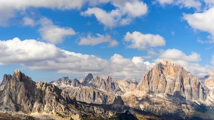 Wall Mural - Colorful scenic time-lapse of majestic Dolomites mountains in Italian Alps. Landscape shot of colorful trees and rocky mountains in the the Italian Dolomites during autumn time.