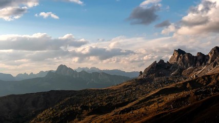 Wall Mural - Beautiful sunset time-lapse shot of majestic Dolomites mountains in Italian Alps. Landscape shot of high rocky mountains in the the Italian Dolomites during Autumn time.