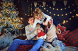 © Studio Romantic - Happy family at home on Christmas.