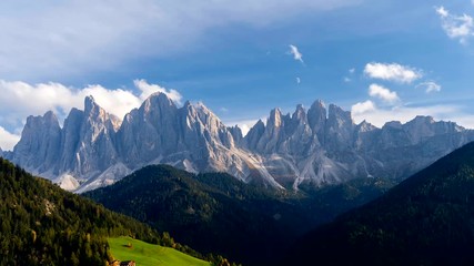 Wall Mural - Time lapse of Santa Magdalena village hills in front of the Geisler or Odle Dolomites Group. Colorful autumn scene of Dolomite Alps, Italy, Europe.