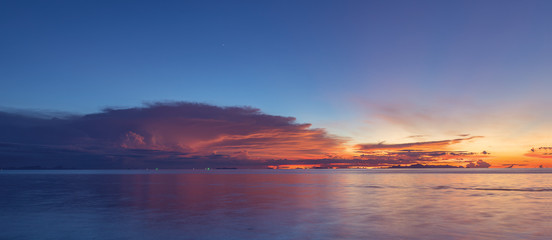 Panoramic dramatic blue sea sky sunset with golden light background,long exposure