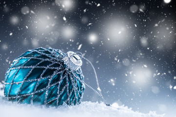 Christmas Luxury ball in snow and abstract snoiwy atmosphere