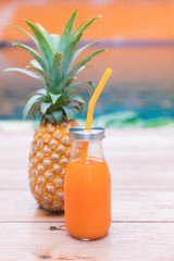 Wall Mural - Fresh yellow pineapple tropic fruit summer refreshment smoothie shake drink near pool