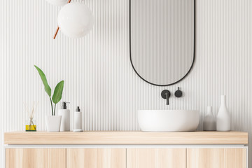 Close up of white bathroom sink