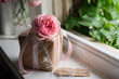 © Gillian Vann/Stocksy - pretty gift with ribbon and pink rose
