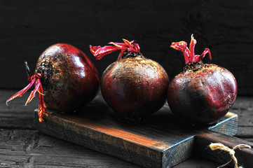 Wall Mural - juicy whole beets on a wooden Board