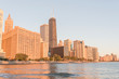 Reflection of Chicago skyscraper on Michigan lake at sunrise