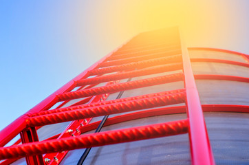 red ladder going into the sky