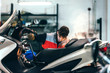 © MyMicrostock/Stocksy - Mechanic working in the motorbike workshop