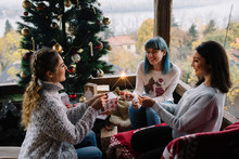 Group Of Friends Spending Time Together At Home For Christmas
