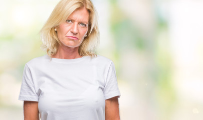 Canvas Print - Middle age blonde woman over isolated background depressed and worry for distress, crying angry and afraid. Sad expression.