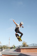 © Rob and Julia Campbell/Stocksy - Kids having fun skating at skateboard park in the sunshine
