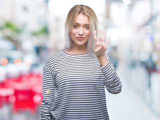 Sticker - Young blonde woman over isolated background showing and pointing up with fingers number four while smiling confident and happy.