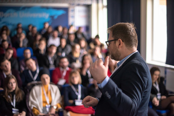 Wall Mural - businessman giving presentations at conference room