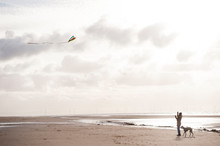 Mature Woman Having Fun Flying A Kite