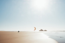 Kitesurfer Walking On The Beach