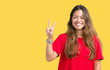 Young beautiful brunette woman wearing red t-shirt over isolated background showing and pointing up with fingers number two while smiling confident and happy.