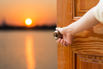 Wall Mural - Women hand open door knob or opening the door.