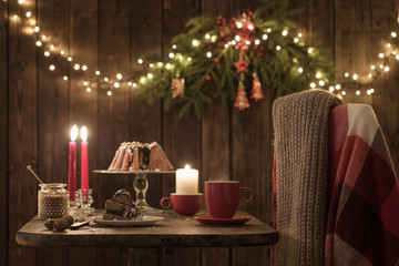 wooden table with Christmas cake and decor