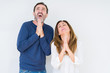 © Krakenimages.com - Beautiful middle age couple in love over isolated background begging and praying with hands together with hope expression on face very emotional and worried. Asking for forgiveness. Religion concept.