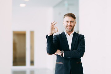 Businessman pointing and holding a palm up. The template for business design.