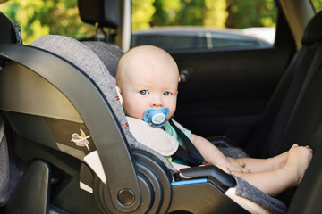 baby boy in   car seat