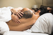 © Ira Efremova Photography/Stocksy - Three handsome naked people sleeping in bed