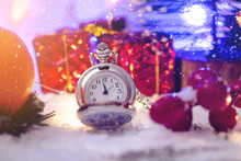 Pocket Watch With A Dial In The Snow With Gifts On The Eve Of Holidays. Waiting For The Magic Of Christmas And New Year