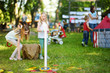 © MNStudio - Children playing ring toss game during annual Medieval Festival, held in Trakai Peninsular Castle.