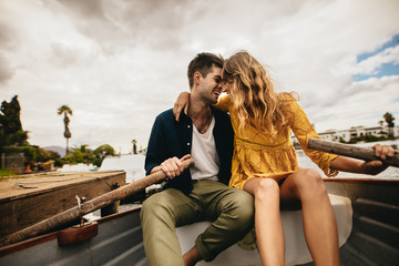 Wall Mural - Couple on a romantic date in a boat