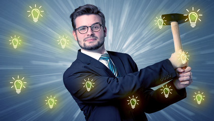 Wall Mural - Better-looking businesman holding tool with idea bulbs concep