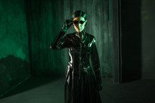Girl Hacker In The Digital World. Young Woman In Matrix Style Suit.
