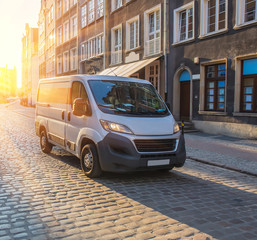 Wall Mural - minivan in the ancient center of the european city