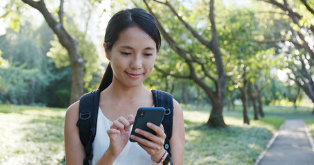 Canvas Print - Woman use of smart phone at the park