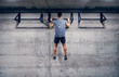 © Dusan Petkovic - Caucasian man doing pull-ups in the gym. Strive for progress and perfection.