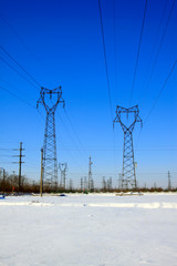 Wall Mural - Electric power tower in the snow