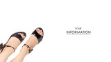 Fototapeta  - Female legs feet black sandals shoes pattern on white background isolation