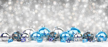 Blue And Silver Christmas Baubles Background 3D Rendering