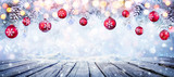 Fototapeta Panele - Christmas Table With Red Hanging Balls In Snowy Background
