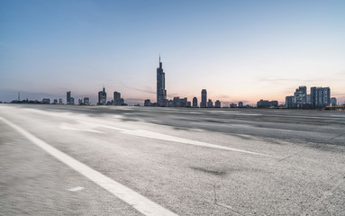 Canvas Print - Panoramic skyline and buildings with empty road 