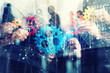 © alphaspirit - Working group of businessmen find the agreement by holding a piece of gear in hand. concept of teamwork and business partnership. double exposure